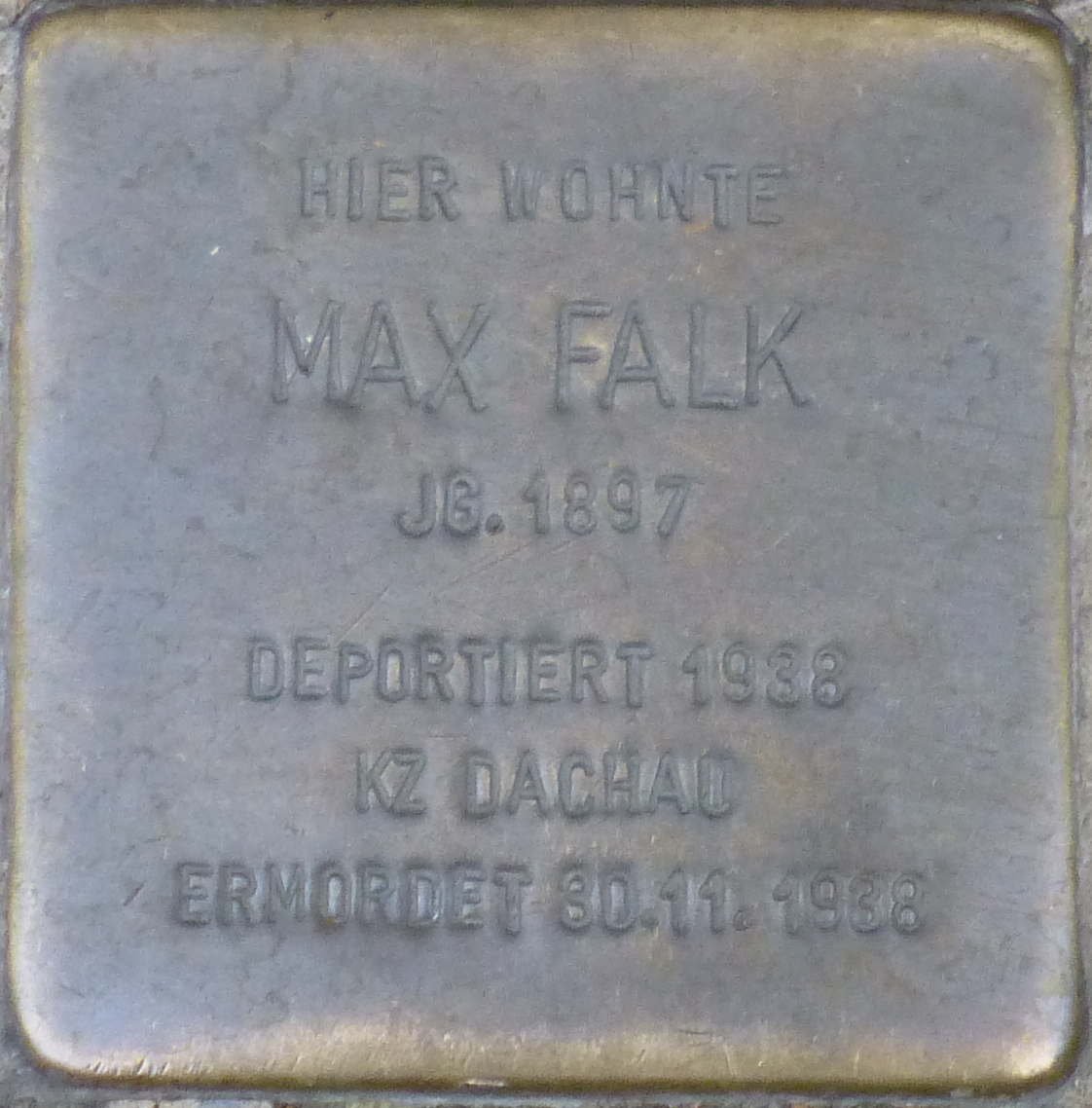 Stolperstein memorial stone dedicated to Max Falk in Karlsruhe, Germany on a cobblestone street