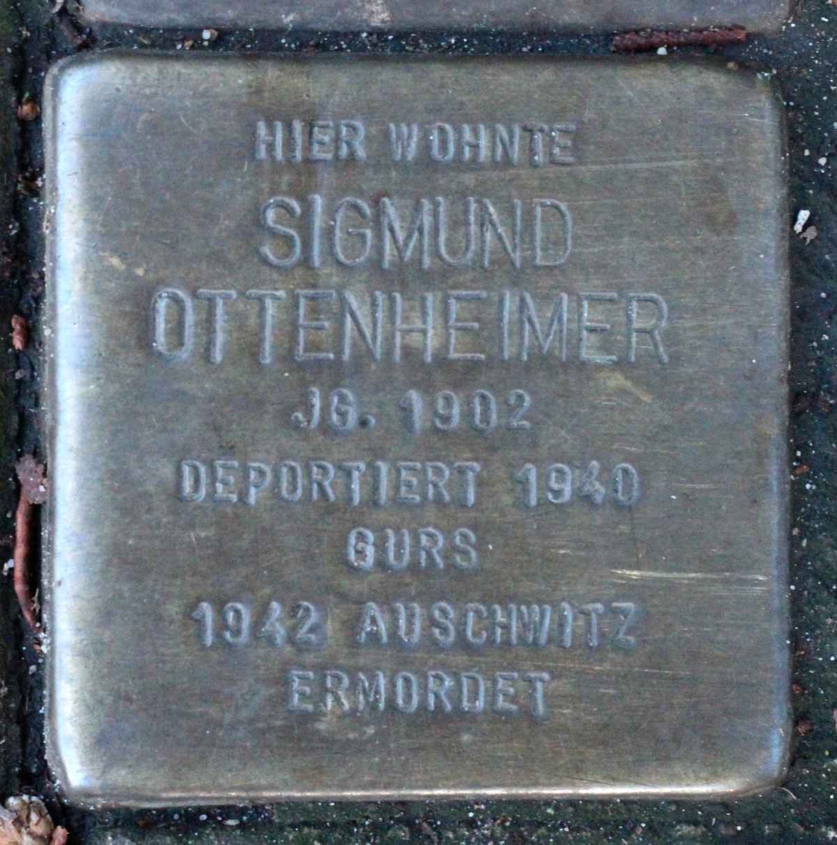 Stolperstein dedicated to Sigmund Ottenheimer in Karlsruhe, Germany embedded in pavement