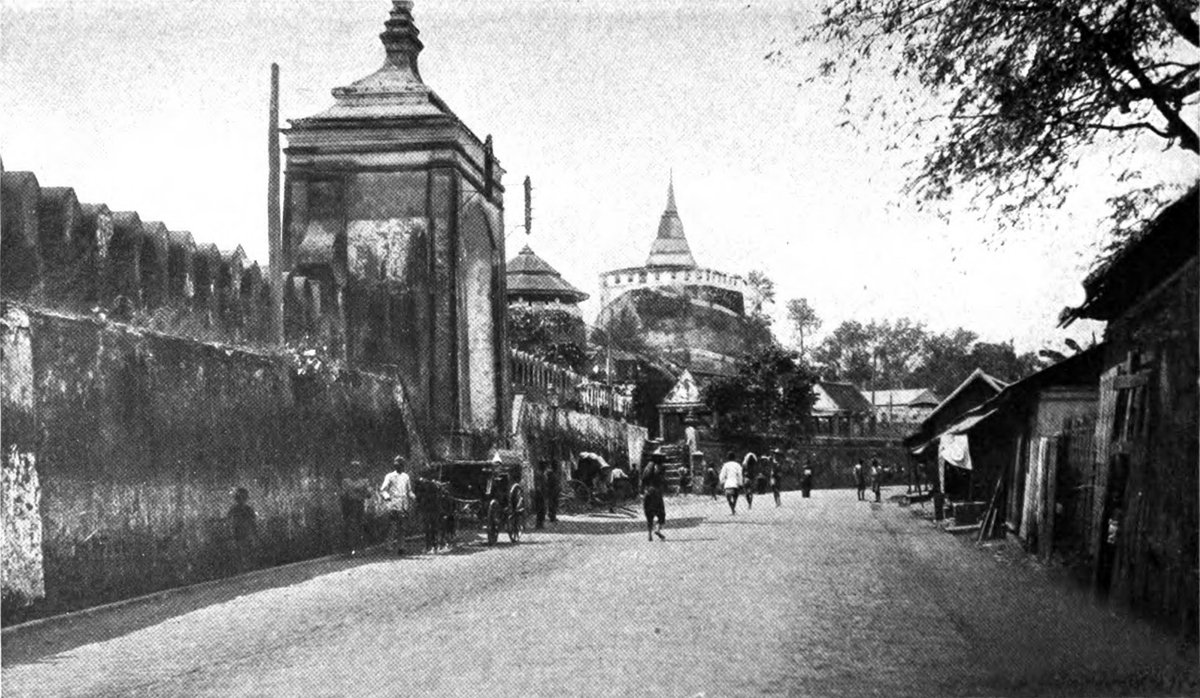 Ancient city wall with Temple of the Golden Mountain in the background, Siam 1904