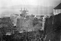 View of Trafalgar Cemetery from Flat Bastion in Gibraltar with historic tombstones and surrounding stone walls