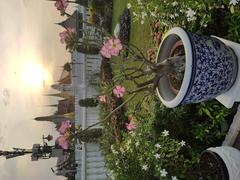 Monument in Thailand with inscriptions and intricate carvings at the city pillar shrine in Bangkok