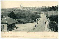 Historical entrance to the city of Luxemburg in 1903 showcasing old architecture and streets