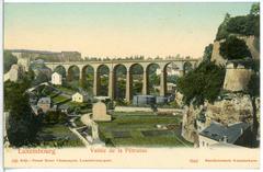 Historic black and white photograph of Vallee de la Petrusse in Luxembourg showing the bridge and surrounding buildings in 1905