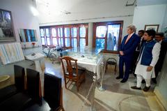 U.S. Secretary of State John Kerry visiting a family's kitchen in Dhaka Bangladesh