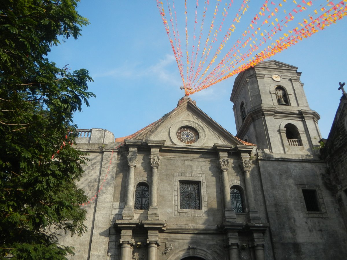 Intramuros Manila streets with historic buildings including San Agustin Church and Manila Cathedral