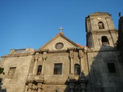 Interior of the Immaculate Conception Parish Church of San Agustin in Intramuros Manila with historical landmarks and gates nearby