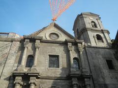 Historial Intramuros district street view featuring San Agustin Church, Manila Cathedral, Plaza de Roma, and King Charles IV monument