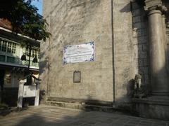 Intramuros Manila streets with historic buildings including San Agustin Church, Manila Cathedral, Plaza de Roma, and King Charles IV monument
