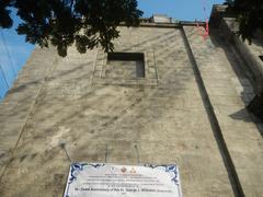 Intramuros Manila street with historic buildings and landmarks including San Agustin Church and Manila Cathedral