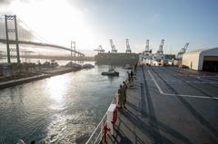 USNS Mercy hospital ship departing Port of Los Angeles with sailors on deck during COVID-19 response