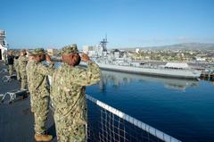 Hospital ship USNS Mercy departing Port of Los Angeles with sailors rendering honors to Battleship USS Iowa Museum