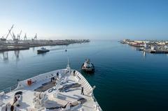 USNS Mercy hospital ship departing Port of Los Angeles with Military Sealift Command civilian mariners handling lines