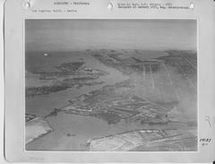 Historic aerial view of downtown Los Angeles with cityscape and mountainous background
