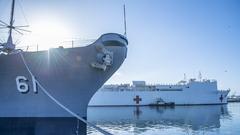 Sailors aboard hospital ship USNS Mercy render honors to Battleship USS Iowa Museum in Los Angeles