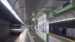 U-Bahn station Schwedenplatz in Vienna with platform and passengers