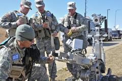 Members of the 82nd Civil Support Team operating a bomb robot equipped with chemical and radiation sensors at Sioux Falls water reclamation plant during a training exercise