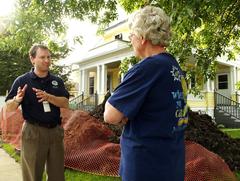 Federal Coordinating Officer Justin Dombrowski talks to a resident about storm damage assistance in Redfield, South Dakota