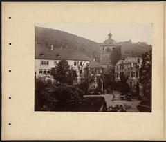 Historic clock tower at Heidelberg Castle photographed with an albumen print in a vintage scrapbook page