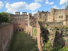View of western moat of Heidelberg Castle featuring Seltenleerm Tower, Ruprechtsbau, Library Building, and English Building