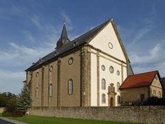 Church in Grauhof with stone facade and tall steeple
