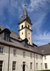 Kloster Grauhof courtyard with historical tower under blue sky