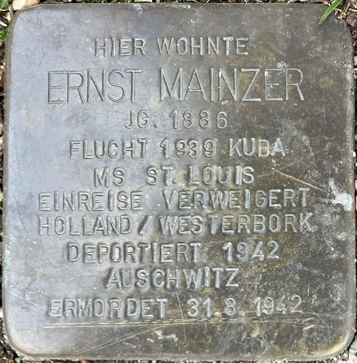 Stolperstein memorial plaque dedicated to Ernst Mainzer embedded in pavement in Baden-Baden, Germany
