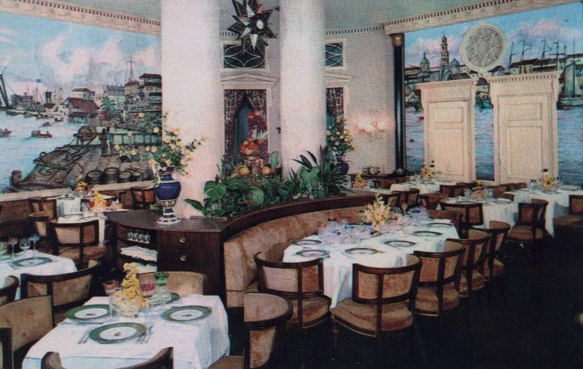 Interior dining room of La Floridita bar in Havana with classic wooden chairs and tables
