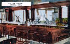 Colorful photomechanical postcard print of La Florida Bar in Havana featuring a vibrant lively street view