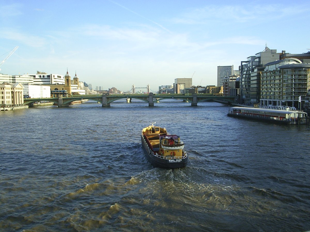 Southwark Bridge over River Thames with Tower Bridge in distance, London