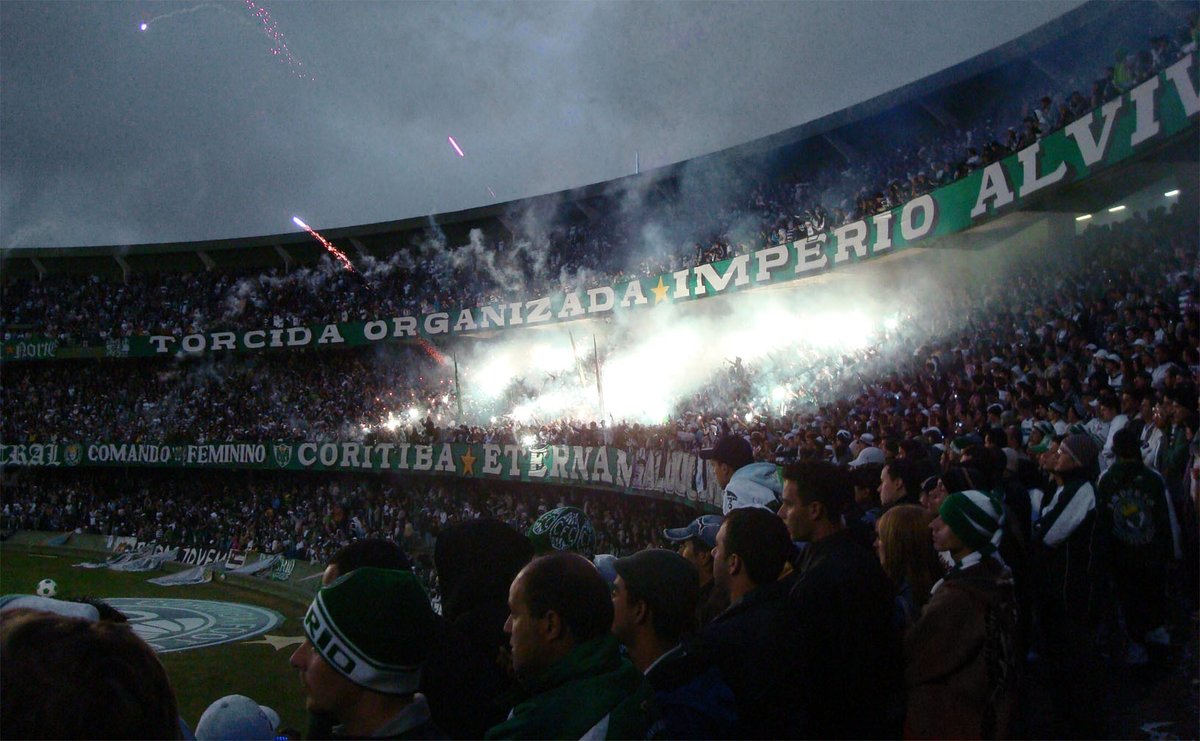 Império Alviverde torcida fans cheering during Coritiba vs. Cruzeiro football match at Estádio Couto Pereira in Curitiba, Paraná, Brazil