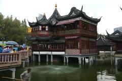 Mid-Lake Pavilion at Yu Garden Shanghai with traditional Chinese architecture and bridge over water