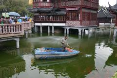 Jiuqu Bridge at Yuyuan Garden in Shanghai China with traditional architecture over a pond
