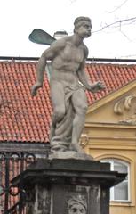 Palazzo dei Quattro Venti in Varsavia with the statue 'Noto' symbolizing wind on Via Długa