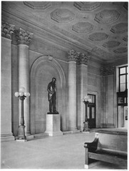 Historic waiting room interior of Windsor Street Station in Montreal with wooden benches and ornate decor