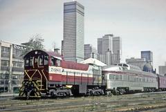 Vintage CP 7086 S2 locomotive pulling cars out of Windsor Station in Montreal on September 6, 1965