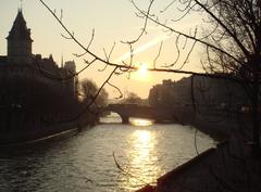Conciergerie building with Pont Saint Michel bridge over the Seine river in Paris