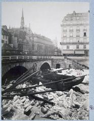 View of frozen Seine river below Quai Saint-Michel with Saint-Michel bridge and Palais de Justice in Paris, 1880