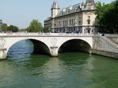 Palais de Justice and Saint-Michel Bridge in Paris at sunset