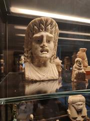 Ancient small figurine and busts from Medelhavsmuseet exhibit