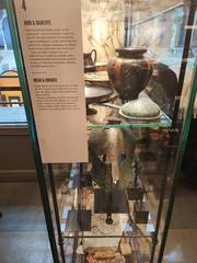 Ancient artifacts exhibited at Medelhavsmuseet including bread and theatrical items