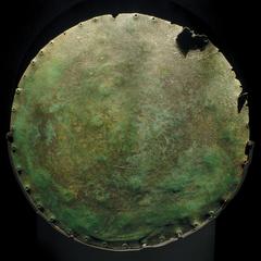 Back side of the Nebra Sky Disc showing detailed Bronze Age artwork