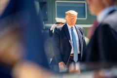 President Donald Trump disembarking Marine One in San Diego, greeted by supporters