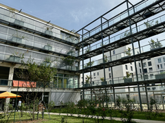 Interior view of IAE Bordeaux campus with modern architectural design and seating areas
