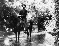 Ed Hunt, Griffith Park policeman, crossing the Los Angeles River on horseback in 1911