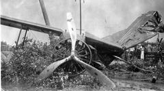 Portrait of pilot Charles Rector in aviation gear from historical photo album