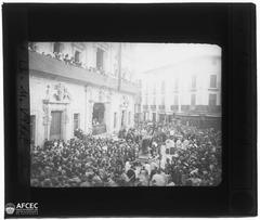 Corpus Christi procession in a street of Palma with people and decorated floats