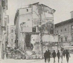 Historical image of Plaça de Cort in 1921 with a small island of houses