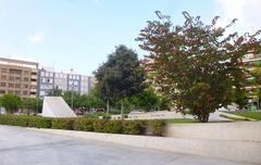 Plaza de Séneca in Alicante with palm trees and a modern high-rise building
