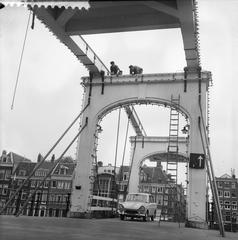 Electricians installing decorative lighting on Magere Brug bridge in Amsterdam, June 1961