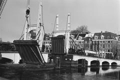 Damaged bridge section being lifted onto barge by crane in Amsterdam, February 1986